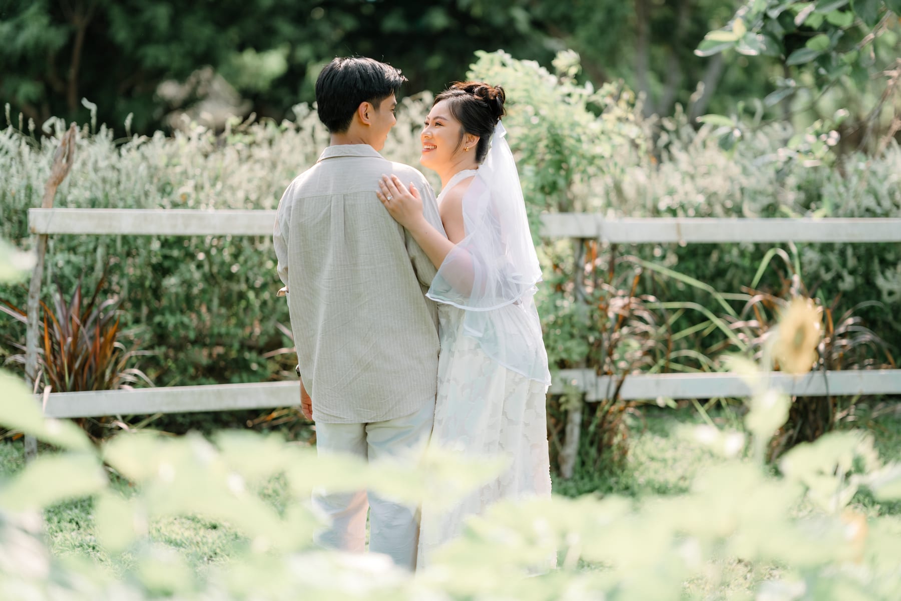 Holding each other by the garden fence